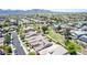 Picturesque neighborhood featuring inviting homes, green spaces, scenic views, and lush lawns at 18072 W Paradise Ln, Surprise, AZ 85388