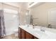 Bathroom featuring a shower-tub combo and double sink vanity at 18072 W Paradise Ln, Surprise, AZ 85388
