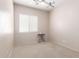 Neutral bedroom featuring a ceiling fan and natural light at 18072 W Paradise Ln, Surprise, AZ 85388