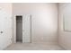 Bedroom featuring carpet, closet with sliding doors, and large window at 18072 W Paradise Ln, Surprise, AZ 85388