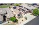 Beautiful desert home featuring manicured landscaping, desert landscape, and a driveway at 18072 W Paradise Ln, Surprise, AZ 85388