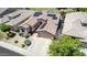 Stunning desert home with a manicured lawn, desert landscaping, a two-car garage, and solar panels at 18072 W Paradise Ln, Surprise, AZ 85388