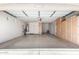Garage with epoxy flooring and built-in storage cabinets at 18072 W Paradise Ln, Surprise, AZ 85388
