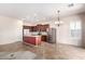 Bright kitchen boasts stainless steel appliances, ample counter space, and dark wood cabinetry at 18072 W Paradise Ln, Surprise, AZ 85388