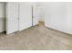 Spacious bedroom with carpet, large closet, and neutral walls; ideal for relaxation and rest at 18207 W Marshall Ln, Surprise, AZ 85388