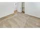 Bright bedroom with beige carpet and neutral walls with an organized closet at 18207 W Marshall Ln, Surprise, AZ 85388
