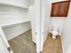 Walk-in closet with shelving and a small toilet room with cabinet at 18207 W Marshall Ln, Surprise, AZ 85388