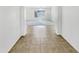 Entryway featuring tile floors, neutral walls, and a view into the living room at 18207 W Marshall Ln, Surprise, AZ 85388