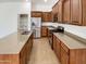Charming kitchen featuring granite countertops, stainless steel appliances, and wooden cabinets at 18207 W Marshall Ln, Surprise, AZ 85388