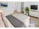 Cozy main bedroom with a comfortable bed, modern dresser, and closet with organizers at 18207 W Marshall Ln, Surprise, AZ 85388