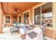 Spacious covered patio with outdoor seating and shaded relaxation area at 18482 W Marconi Ave, Surprise, AZ 85388