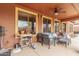 Covered back patio featuring outdoor seating and views of the backyard at 18482 W Marconi Ave, Surprise, AZ 85388