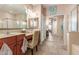 Bathroom with double sinks, vanity area, a large mirror and a walk in shower at 18482 W Marconi Ave, Surprise, AZ 85388