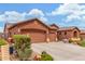 Spacious home with a multi-car garage, a wide driveway, and low-maintenance landscaping in the front yard at 18482 W Marconi Ave, Surprise, AZ 85388