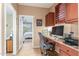 Home office area with a computer desk and a view of a bedroom at 18482 W Marconi Ave, Surprise, AZ 85388