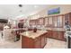 Bright kitchen with large island, granite countertops, and eat-in table, perfect for entertaining at 18482 W Marconi Ave, Surprise, AZ 85388