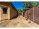 Side yard with block fencing provides privacy and ample room for gardening or storage at 18775 E Seagull Dr, Queen Creek, AZ 85142