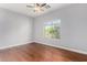 Bedroom featuring hardwood floors, natural light from the window, ceiling fan, and neutral walls at 18775 E Seagull Dr, Queen Creek, AZ 85142