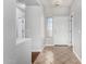 Bright foyer with neutral walls, tile floors, and an accent wall at 18775 E Seagull Dr, Queen Creek, AZ 85142