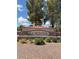 Community entrance with Cortina sign nestled in manicured landscaping at 18775 E Seagull Dr, Queen Creek, AZ 85142