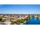 Overhead view of community homes surrounding a lake, showcasing the neighborhood's layout and waterfront access at 19942 N 108Th Ave, Peoria, AZ 85373