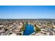 Breathtaking aerial view of the community with a serene lake and lush landscaping at 19942 N 108Th Ave, Peoria, AZ 85373