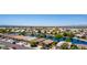 Scenic aerial view of homes surrounding a central lake, providing an overview of the community's layout and design at 19942 N 108Th Ave, Peoria, AZ 85373