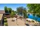 The backyard has a view of the lake with a low-maintenance desert landscape and charming bird feeder at 19942 N 108Th Ave, Peoria, AZ 85373
