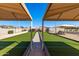 Community bocce ball court featuring covered seating areas, ideal for leisurely games and outdoor enjoyment at 19942 N 108Th Ave, Peoria, AZ 85373