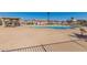 Inviting community pool area with ample seating, perfect for relaxation and enjoying sunny days in a gated setting at 19942 N 108Th Ave, Peoria, AZ 85373