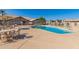 Sparkling community pool surrounded by comfortable lounge chairs and tables, ideal for relaxing and socializing at 19942 N 108Th Ave, Peoria, AZ 85373