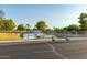 Neighborhood pond with fountain, lush landscaping, and safety fencing for community enjoyment at 19942 N 108Th Ave, Peoria, AZ 85373