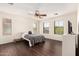 Bright bedroom with hardwood floors, ceiling fan, and multiple windows offering natural light at 20045 N 49Th Dr, Glendale, AZ 85308