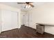 Bedroom features wood floors, ceiling fan, closet and built in desk at 20045 N 49Th Dr, Glendale, AZ 85308
