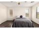 Spacious bedroom features a ceiling fan and natural light from the windows at 20045 N 49Th Dr, Glendale, AZ 85308