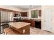 Modern kitchen featuring granite countertops, stainless steel appliances, and a functional kitchen island at 20045 N 49Th Dr, Glendale, AZ 85308