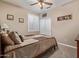 Comfortable bedroom with a ceiling fan, window, carpet, and closet at 20420 N 93Rd Dr, Peoria, AZ 85382