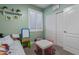 Bright bedroom with a window, comfortable bed, neutral carpet and area at 20420 N 93Rd Dr, Peoria, AZ 85382
