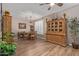 Cozy dining room with hardwood floors, featuring a stylish chandelier and classic wooden furniture at 20420 N 93Rd Dr, Peoria, AZ 85382