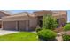 Charming home showcasing a well-manicured lawn and attractive landscaping that enhances its curb appeal at 20420 N 93Rd Dr, Peoria, AZ 85382