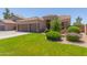 Charming home showcasing a well-manicured lawn and attractive landscaping that enhances its curb appeal at 20420 N 93Rd Dr, Peoria, AZ 85382