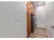 Convenient laundry room equipped with upper cabinets and modern washer and dryer units at 20420 N 93Rd Dr, Peoria, AZ 85382