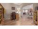 Comfortable home office flows into a dining area, featuring wood-look floors and a neutral color scheme at 20420 N 93Rd Dr, Peoria, AZ 85382