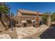 Custom outdoor kitchen with built-in BBQ and ample counter space, ideal for outdoor cooking at 20420 N 93Rd Dr, Peoria, AZ 85382