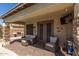 Inviting covered patio with comfortable seating, perfect for outdoor relaxation and entertaining at 20420 N 93Rd Dr, Peoria, AZ 85382