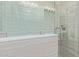Modern bathroom shower with decorative tiles and sleek glass enclosure, ready for relaxation at 20420 N 93Rd Dr, Peoria, AZ 85382
