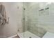 Modern glass shower with updated tile, a built-in niche, and a bench seat at 20420 N 93Rd Dr, Peoria, AZ 85382