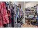 Spacious walk-in closet with shelving and hanging racks for ample storage at 20420 N 93Rd Dr, Peoria, AZ 85382