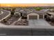 Aerial view of a single-story home with desert landscaping, and a two-car garage at 20506 N 271St Ave, Buckeye, AZ 85396