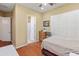 A bedroom with hardwood floors and an ensuite bathroom at 20506 N 271St Ave, Buckeye, AZ 85396